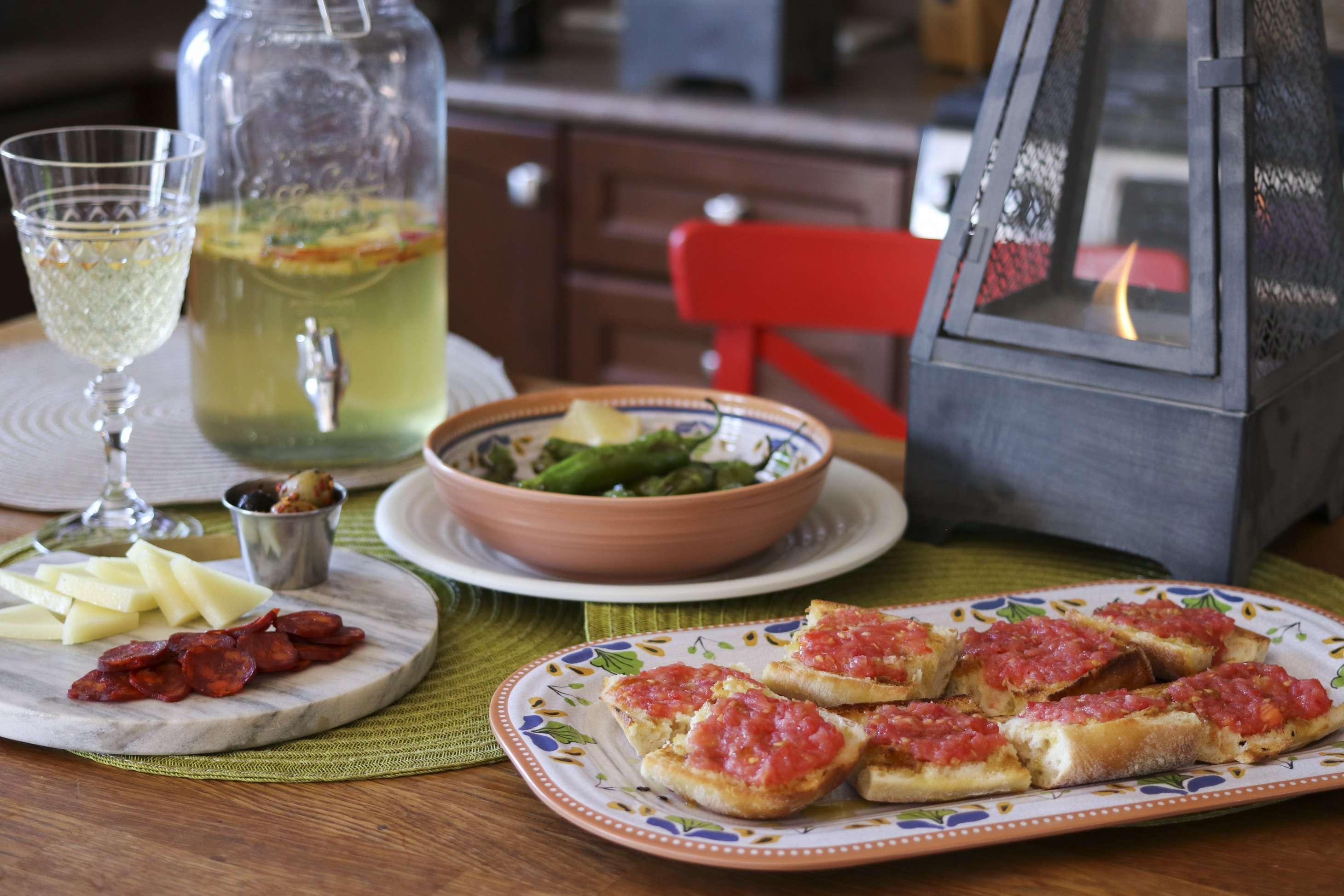 Julie Miguel Lifestyle and Food Blogger of Daily Tiramisu Blog shows you how to create the Ultimate Spanish Tapas Spread with recipes for Spanish Tomato Bread, Shishito peppers and a spanish cheese board www.juliemiguel.com/tapas